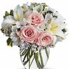 Pale pink roses with white flowers in vase