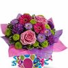 Festive pink and purple flower arrangement
