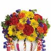 Bright mixed bouquet of colorful flowers arranged in a vase.