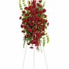 All-red standing spray with roses and carnations