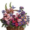 Basket bouquet with pink and purple flowers