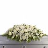 Full casket spray with all-white flowers