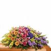 Half casket spray with colorful flowers