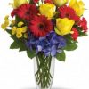 Bright mixed flower bouquet in a bold vase