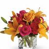 Bright pink and yellow flower bouquet with roses