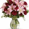 Vibrant mixed bouquet of colorful seasonal flowers arranged with greenery.