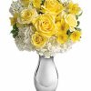 Yellow roses with white hydrangea in vase