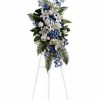 Blue and white roses with lilies standing spray