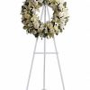 All-white wreath with roses and lilies