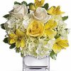 Yellow and white roses with hydrangea in vase