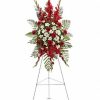 Red and white standing spray with carnations and greenery