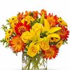 Yellow and red-orange flowers in wicker basket