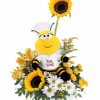 Colorful bouquet of bright flowers in a bee-themed vase.
