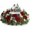 Festive holiday centerpiece with red flowers